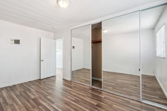 4402 Delta St Unit 23, San Diego, CA 92113 - unfurnished bedroom featuring wood finished floors and a closet