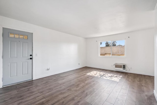 4402 Delta St Unit 23, San Diego, CA 92113 - spare room with wood finished floors and a wall mounted air conditioner