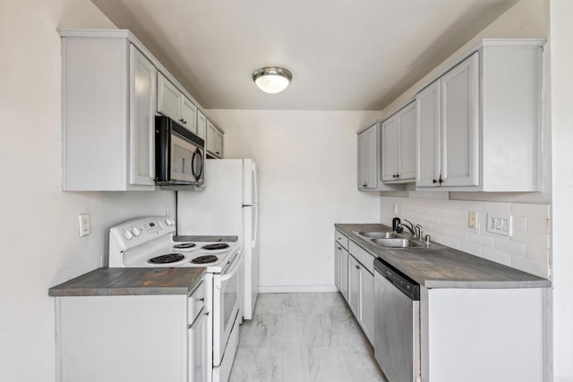 4402 Delta St Unit 23, San Diego, CA 92113 - kitchen with white range with electric stovetop, black microwave, stainless steel dishwasher, and dark countertops