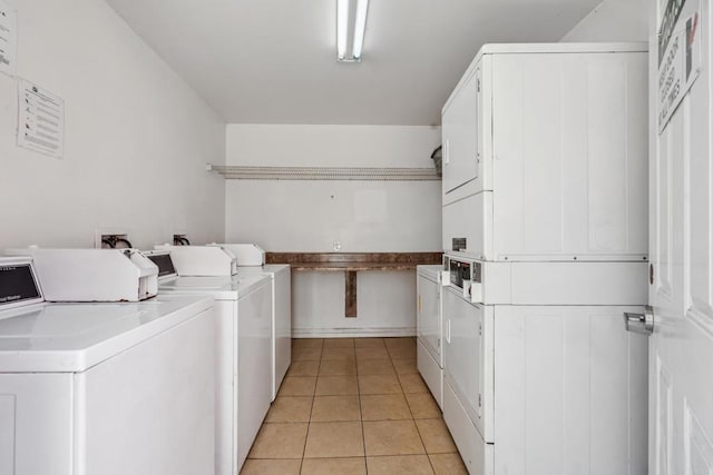 4402 Delta St Unit 23, San Diego, CA 92113 - shared laundry featuring stacked washing machine and dryer, separate washer and dryer, and light tile patterned floors