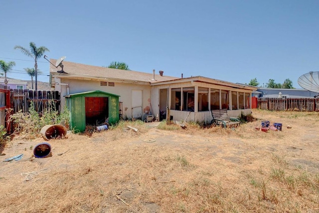 10151 Strathmore Dr, Santee, CA 92071 - back of house featuring a sunroom, a shed, and stucco siding