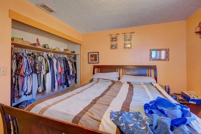 10151 Strathmore Dr, Santee, CA 92071 - bedroom featuring a textured ceiling and a closet
