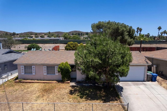 10151 Strathmore Dr, Santee, CA 92071 - view of front facade featuring a mountain view, concrete driveway, and an attached garage