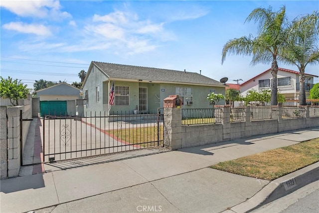 1932 S Orange Ave, West Covina, CA 91790 - view of front facade featuring stucco siding, a fenced front yard, and driveway