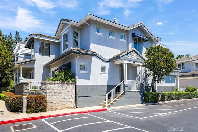 41 Breakers Ln, Aliso Viejo, CA 92656 - view of property featuring uncovered parking