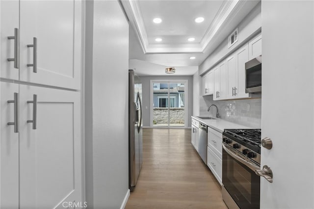 41 Breakers Ln, Aliso Viejo, CA 92656 - kitchen with appliances with stainless steel finishes, crown molding, white cabinetry, recessed lighting, and tasteful backsplash