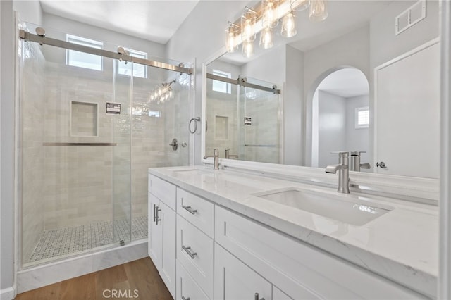41 Breakers Ln, Aliso Viejo, CA 92656 - full bath featuring double vanity, a stall shower, and wood finished floors