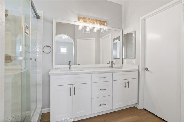 41 Breakers Ln, Aliso Viejo, CA 92656 - full bathroom with a shower stall, double vanity, and wood finished floors