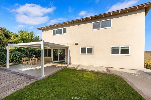 11685 Lakia Dr, Cypress, CA 90630 - back of property with a patio area and stucco siding
