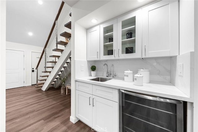 11685 Lakia Dr, Cypress, CA 90630 - bar with wine cooler, stairway, dark wood-type flooring, recessed lighting, and tasteful backsplash