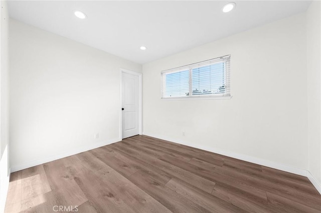 11685 Lakia Dr, Cypress, CA 90630 - spare room featuring wood finished floors and recessed lighting