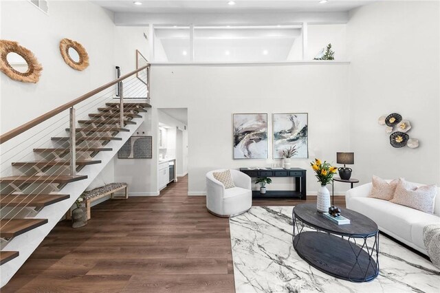 11685 Lakia Dr, Cypress, CA 90630 - living room with stairs, a towering ceiling, wood finished floors, and recessed lighting