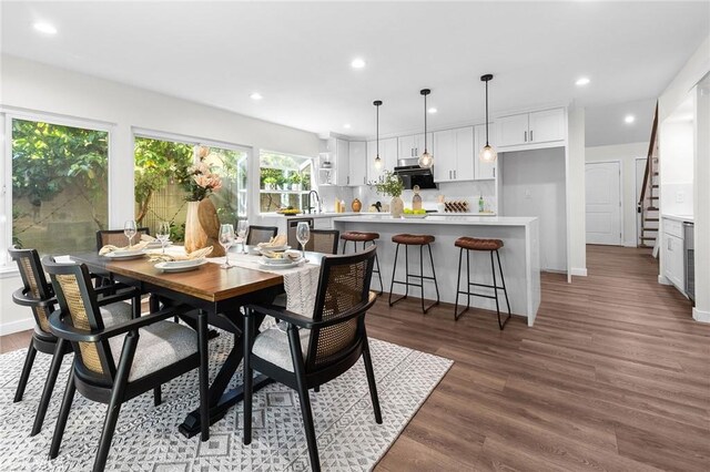 11685 Lakia Dr, Cypress, CA 90630 - dining space with wood finished floors, recessed lighting, and stairs