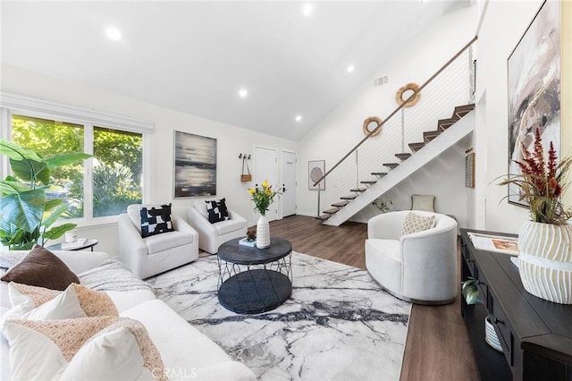 11685 Lakia Dr, Cypress, CA 90630 - living room featuring stairway, wood finished floors, recessed lighting, and high vaulted ceiling