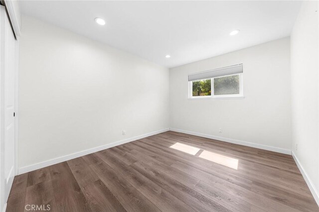 11685 Lakia Dr, Cypress, CA 90630 - empty room with wood finished floors and recessed lighting