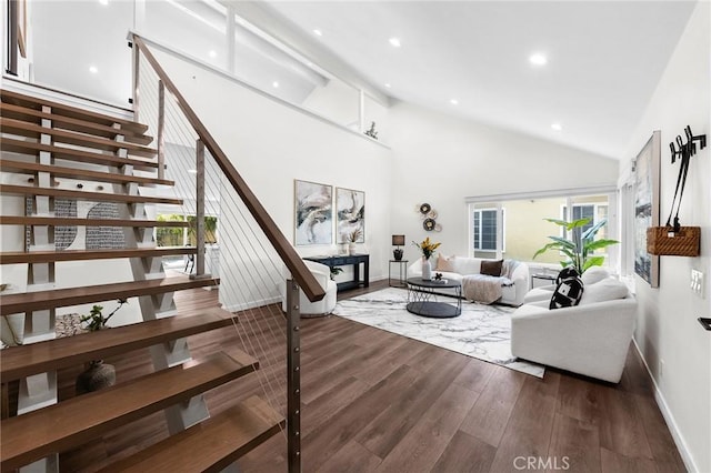 11685 Lakia Dr, Cypress, CA 90630 - living area featuring dark wood finished floors, recessed lighting, high vaulted ceiling, and stairs
