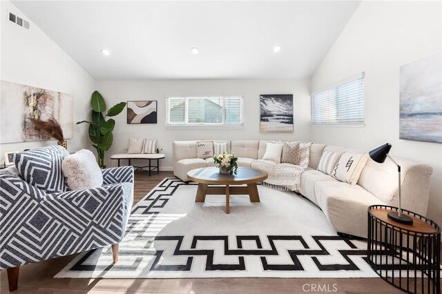 11685 Lakia Dr, Cypress, CA 90630 - living room with lofted ceiling, plenty of natural light, recessed lighting, and wood finished floors