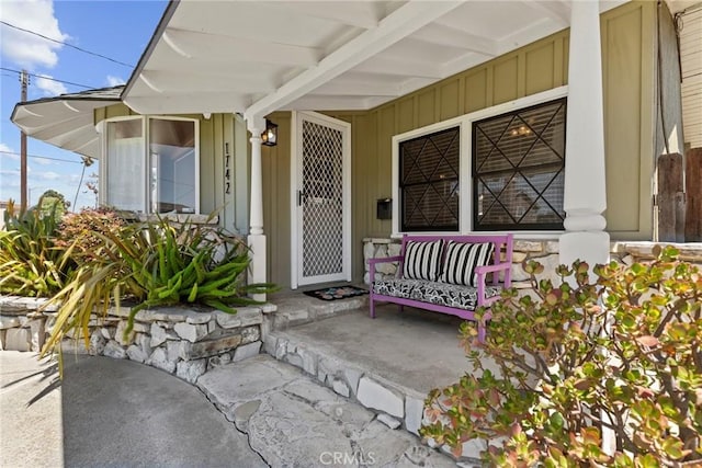 1742 253rd St, Lomita, CA 90717 - view of exterior entry featuring a porch and board and batten siding