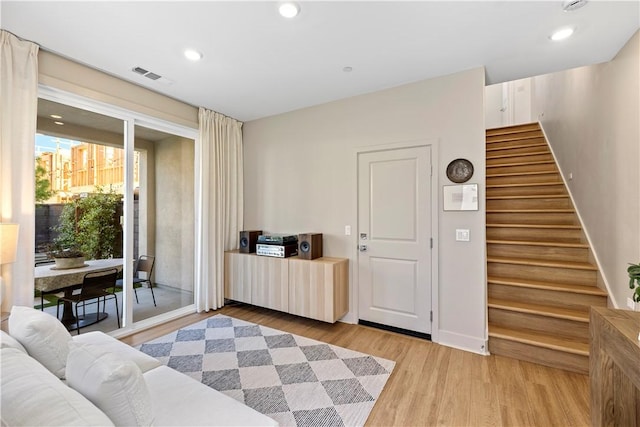 1281 Windmill Rd, Rancho Mission Viejo, CA 92694 - living area with light wood-type flooring, stairs, and recessed lighting
