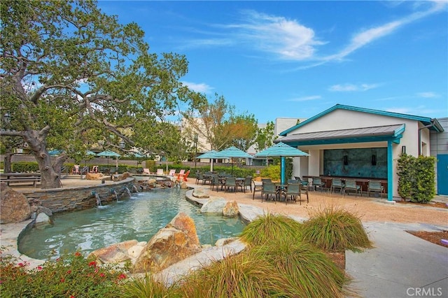 1281 Windmill Rd, Rancho Mission Viejo, CA 92694 - surrounding community featuring a swimming pool, a patio area, and outdoor dining area