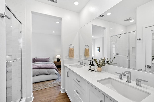 1281 Windmill Rd, Rancho Mission Viejo, CA 92694 - full bath featuring ensuite bathroom, a shower stall, double vanity, wood finished floors, and recessed lighting