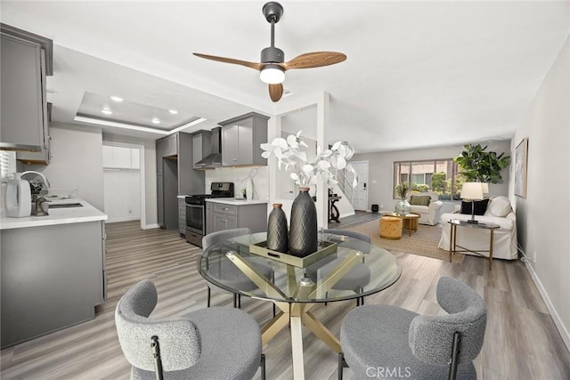931 W Duarte Rd Unit 6, Arcadia, CA 91007 - dining space featuring a ceiling fan, a raised ceiling, light wood finished floors, and recessed lighting