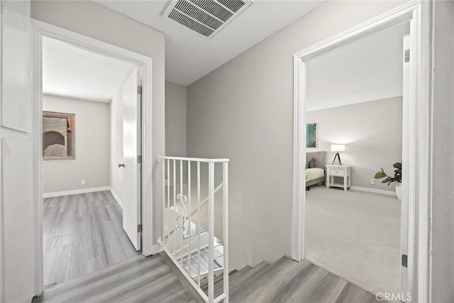931 W Duarte Rd Unit 6, Arcadia, CA 91007 - hallway featuring an upstairs landing and wood finished floors