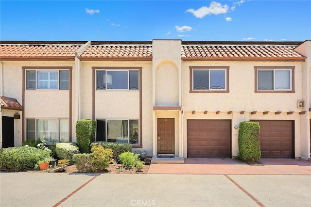 931 W Duarte Rd Unit 6, Arcadia, CA 91007 - view of property with a tiled roof, stucco siding, a garage, and driveway