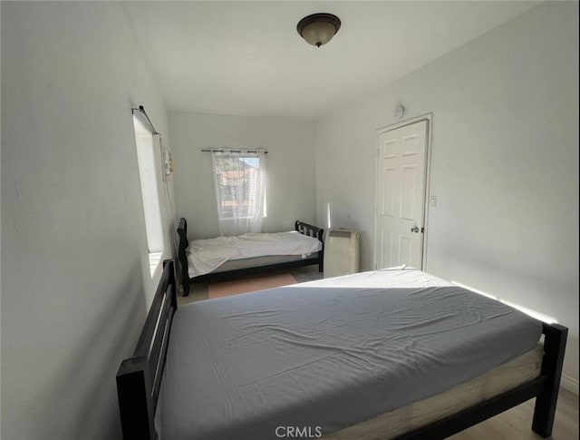 10945-10953 Campbell Ave, Riverside, CA 92505 - bedroom with baseboards and wood finished floors