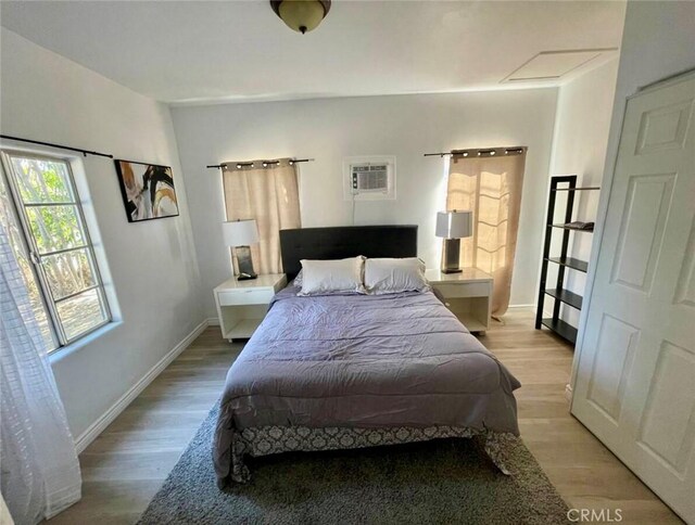 10945-10953 Campbell Ave, Riverside, CA 92505 - bedroom with light wood-style floors and a wall mounted AC