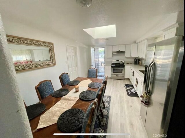 10945-10953 Campbell Ave, Riverside, CA 92505 - dining area with a skylight and light wood-style floors