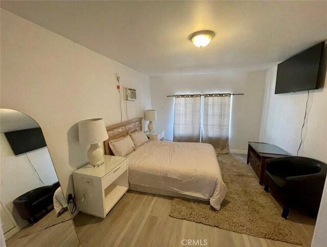 10945-10953 Campbell Ave, Riverside, CA 92505 - bedroom with light wood finished floors and a wall unit AC