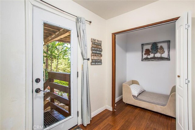 30421 Live Oak Dr, Running Springs, CA 92382 - doorway to outside featuring dark wood-type flooring and baseboards