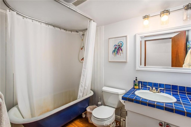 30421 Live Oak Dr, Running Springs, CA 92382 - full bathroom with vanity and shower / bath combo with shower curtain