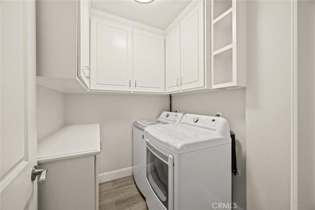 10210 Green St Unit 10210B, Temple City, CA 91780 - laundry room featuring cabinet space, washing machine and dryer, and light wood-type flooring