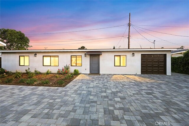 10210 Green St Unit 10210B, Temple City, CA 91780 - view of front of home featuring stucco siding, an attached garage, and decorative driveway