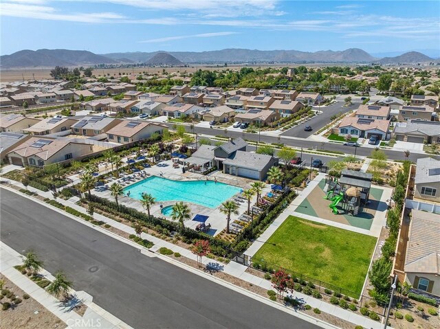 1943 Auger Pl, Hemet, CA 92545 - aerial perspective of suburban area featuring a pool area and a mountain backdrop