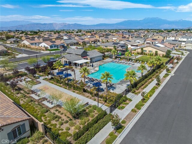1943 Auger Pl, Hemet, CA 92545 - aerial perspective of suburban area featuring a pool and a mountainous background