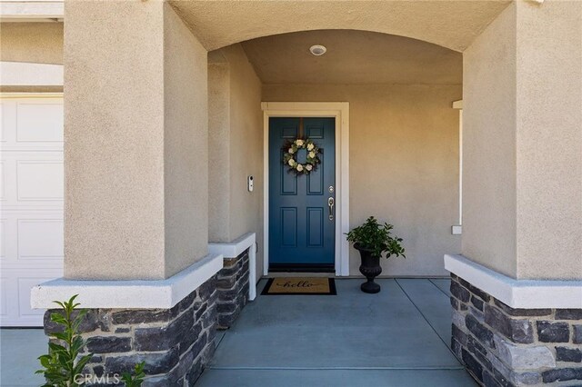 1943 Auger Pl, Hemet, CA 92545 - doorway to property featuring stucco siding