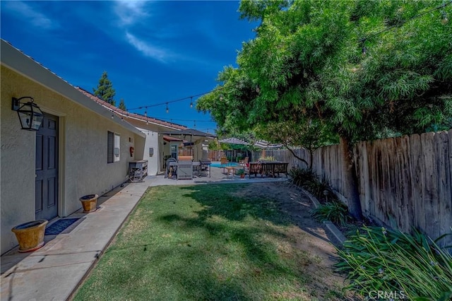 770 Warbler Ct, Merced, CA 95340 - fenced backyard featuring a patio