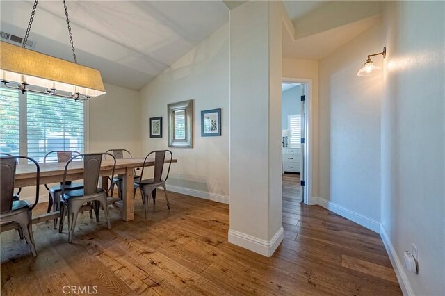770 Warbler Ct, Merced, CA 95340 - dining space with vaulted ceiling, wood-type flooring, and healthy amount of natural light
