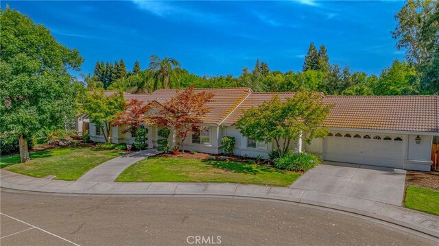 770 Warbler Ct, Merced, CA 95340 - view of front of property featuring a tile roof, a garage, concrete driveway, and a front yard