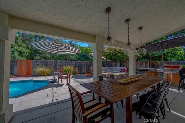 770 Warbler Ct, Merced, CA 95340 - fenced backyard featuring a patio area, outdoor dining space, and a grill