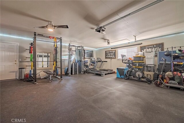 770 Warbler Ct, Merced, CA 95340 - garage featuring a garage door opener and ceiling fan