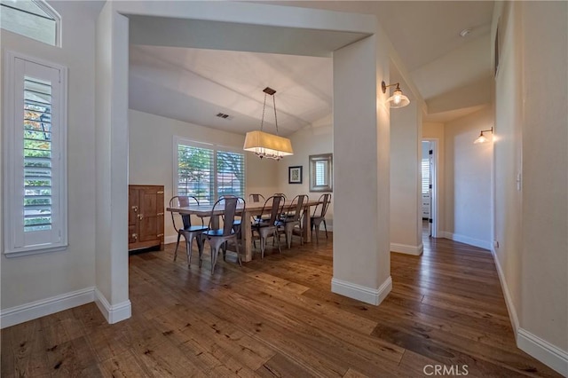 770 Warbler Ct, Merced, CA 95340 - dining space featuring wood finished floors, vaulted ceiling, and a chandelier