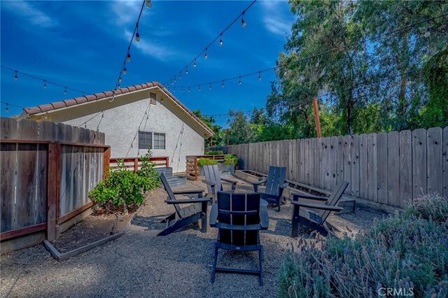 770 Warbler Ct, Merced, CA 95340 - fenced backyard featuring an outdoor fire pit