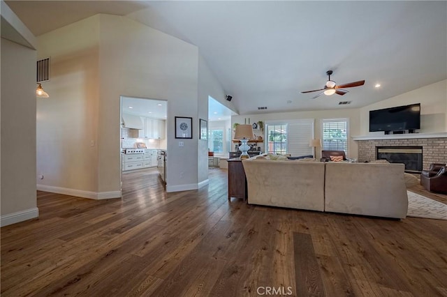 770 Warbler Ct, Merced, CA 95340 - living area featuring lofted ceiling, a fireplace, ceiling fan, and wood finished floors