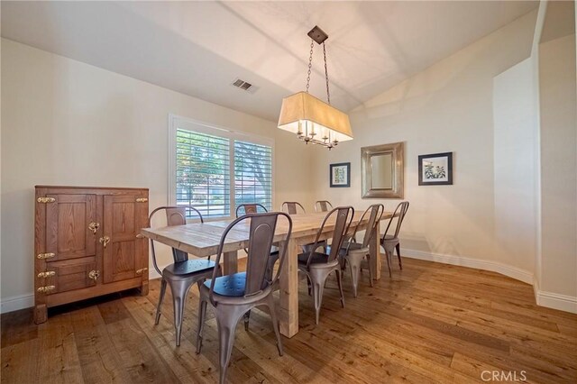 770 Warbler Ct, Merced, CA 95340 - dining space featuring hardwood / wood-style floors, a chandelier, and lofted ceiling