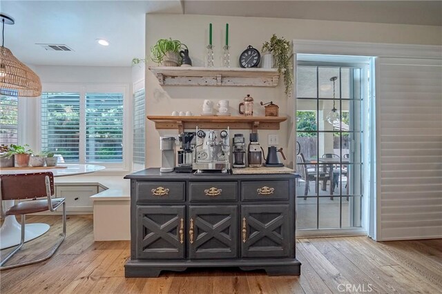 770 Warbler Ct, Merced, CA 95340 - bar area with light wood finished floors, healthy amount of natural light, recessed lighting, and decorative light fixtures