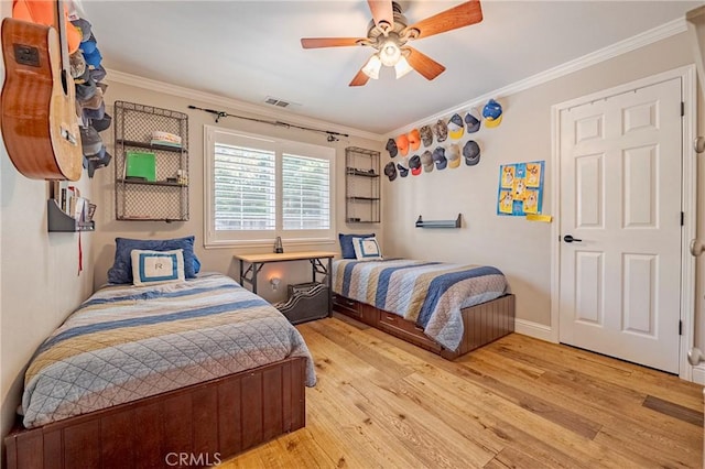 770 Warbler Ct, Merced, CA 95340 - bedroom featuring wood finished floors, crown molding, and ceiling fan